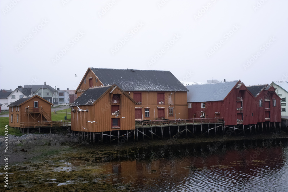 Vardo, Norway - August 3, 2022: Beautiful scenery of Vardo town and surroundings in the Finnmark during a summer cloudy day. Selective focus. Vardo, Norway - August 3, 2022: Beautiful scenery of Vardo town and surroundings in the Finnmark during a summer cloudy day. Selective focus.