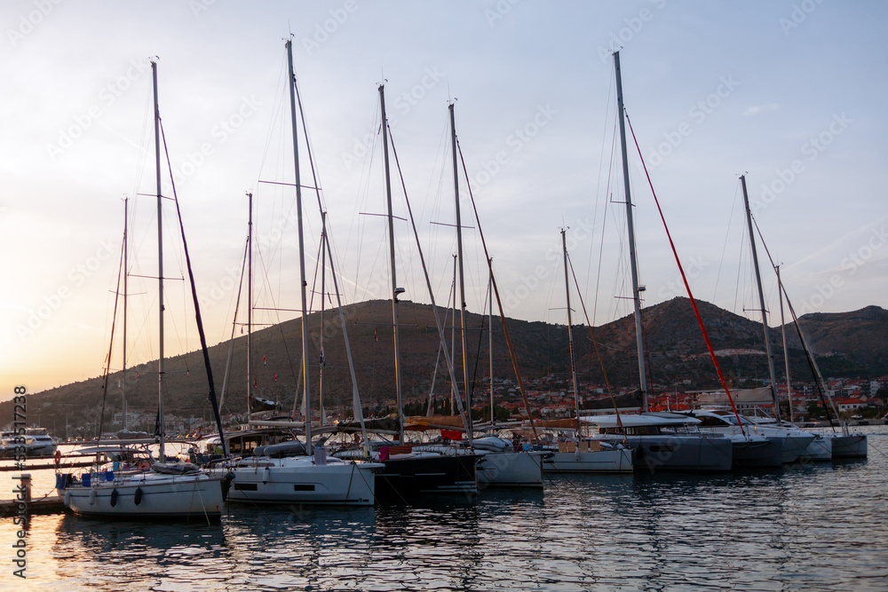 Yachts at wharf in the evening dusk 
