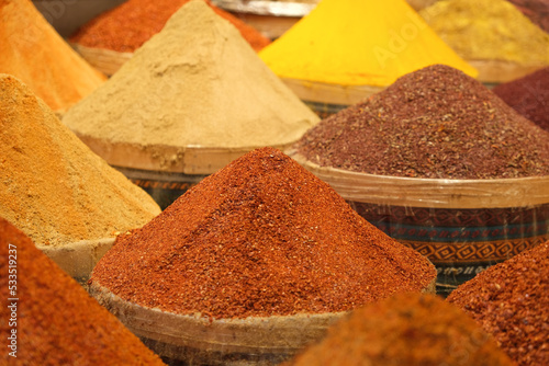 Colorful various red pepper curry cardamom  cinnamon seasoning spices at bazaar in İstanbul Turkey. Selective focus area.