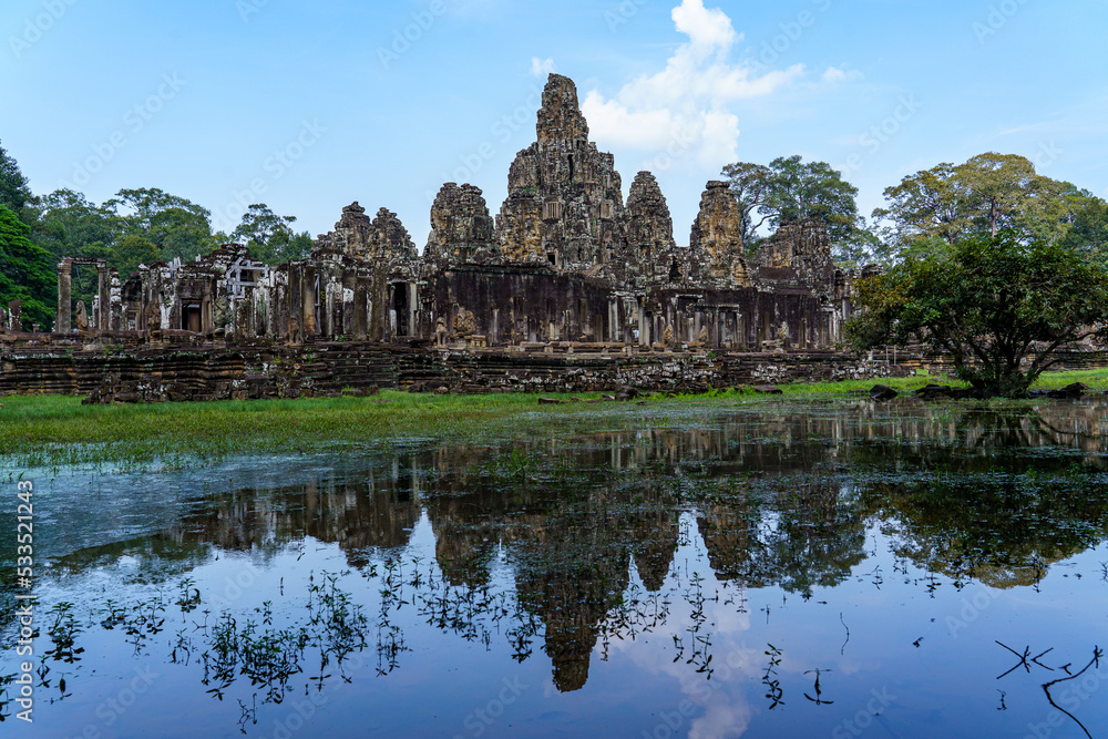Cambodia. Siam Reap. The archaeological park of Angkor. The Bayon temple 12th century Hindu temple and its reflection on the lake Cambodia. Siam Reap. The archaeological park of Angkor. The Bayon temple 12th century Hindu temple and its reflection on the lake