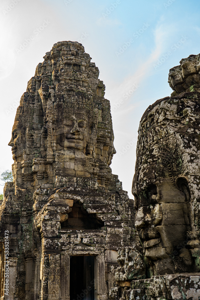 Cambodia. Siem Reap. The archaeological park of Angkor. Heads of Buddha sculpture at Bayon Temple 12th century Hindu temple