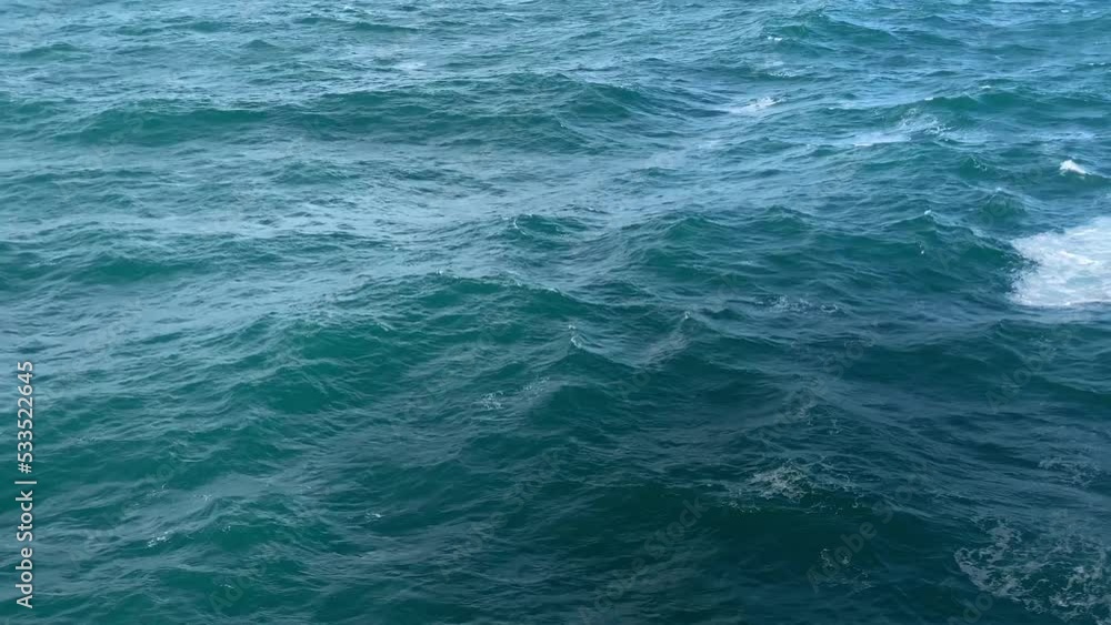 Wake of vessel. Trace from ship. Ocean water. Back view. Deep green blue. Wake cruise ship ocean water. Beautiful Ocean water wake behind large cruise ship. Wake of vessel. Trace from ship. Ocean water. Back view. Deep green blue. Wake cruise ship ocean water. Beautiful Ocean water wake behind large cruise ship.