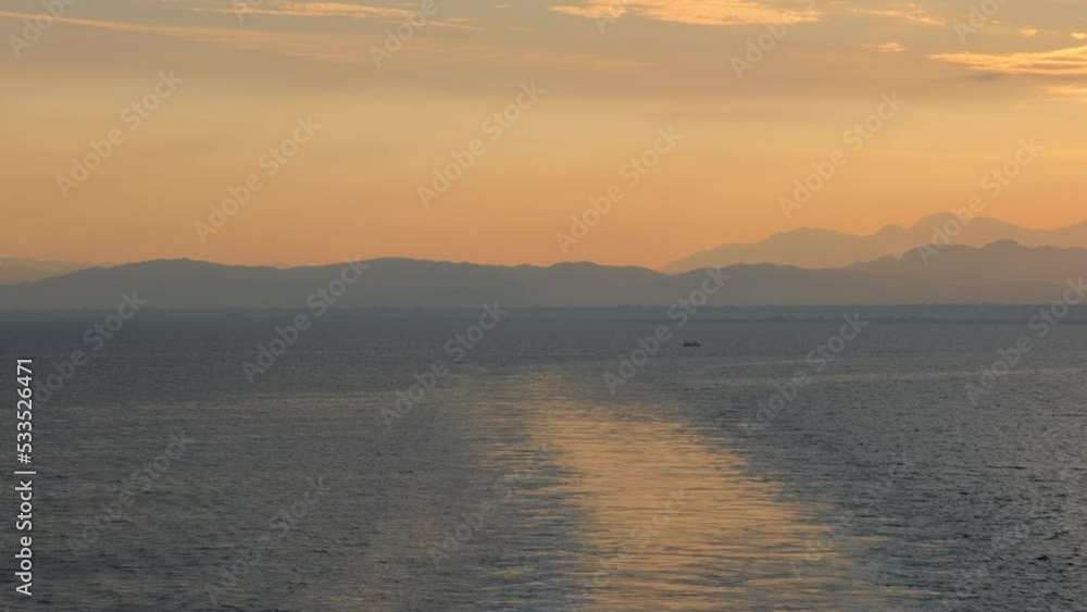 Amazing sunrise over the tropical beach. Yellow sun over sea. Orange colors waves. Nature background. Beautiful serene scene. Morning. Sunlight reflect on water surface Amazing sunrise over the tropical beach. Yellow sun over sea. Orange colors waves. Nature background. Beautiful serene scene. Morning. Sunlight reflect on water surface