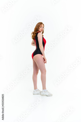 model size posing bodysuit on white background © sutulastock