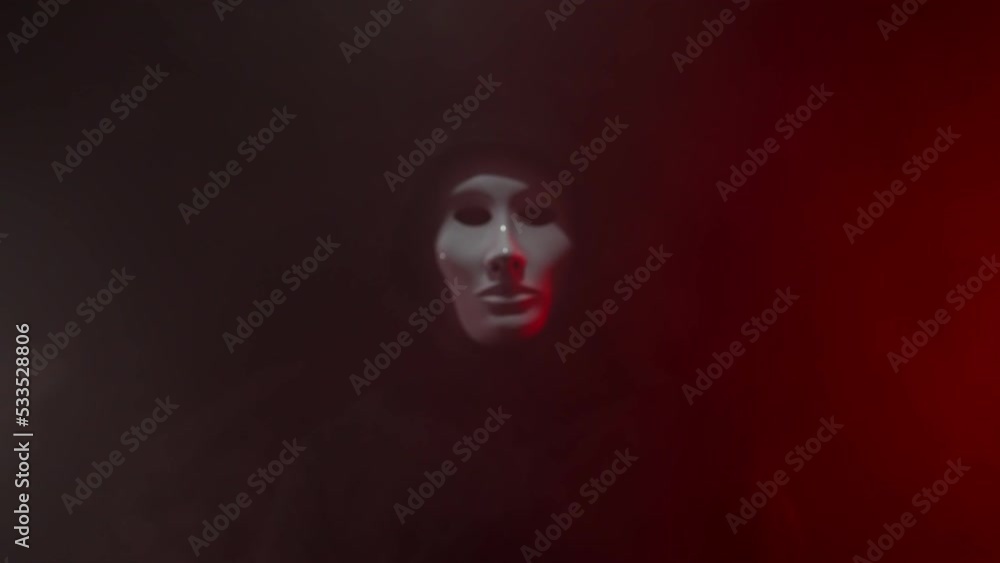 Man wearing mask with hoodie on neon background. Man wearing mask with hoodie on neon background.