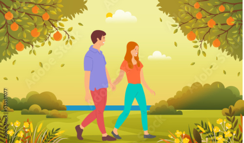 Family walks in city park. Young people in relationship spending time together oudoor. Couple in love walking by handle in forest. Guy and girl communicate and relax in spring or summer garden