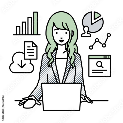 デスクでPCを前にリサーチ・データ分析・レポート作成をしているスーツの女性