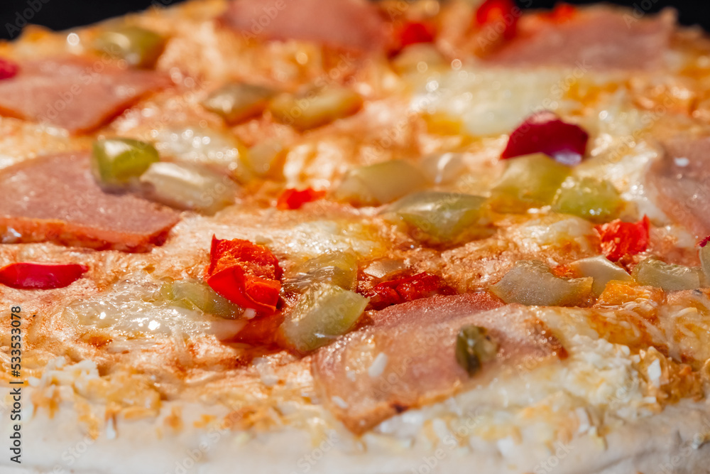 Baked pizza with with sausage, mushroom, pepper, cheese on tray in electric oven - close up. Italian cuisine fast food, homemade bakery concept Baked pizza with with sausage, mushroom, pepper, cheese on tray in electric oven - close up. Italian cuisine fast food, homemade bakery concept