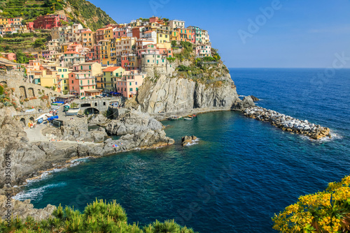 Manarola bay above cliffs, Cinque Terre, Liguria, Italy with boats