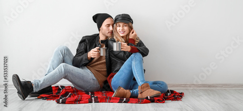Happy young couple in warm ...