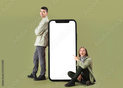 Young couple near big smart...