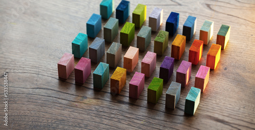 Foto Spectrum of colorful wooden blocks aligned on a rustic old wood table