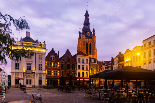 Picturesque view of city of Kortrijk with illuminated main square and St Martins Church, Flanders, Belgium