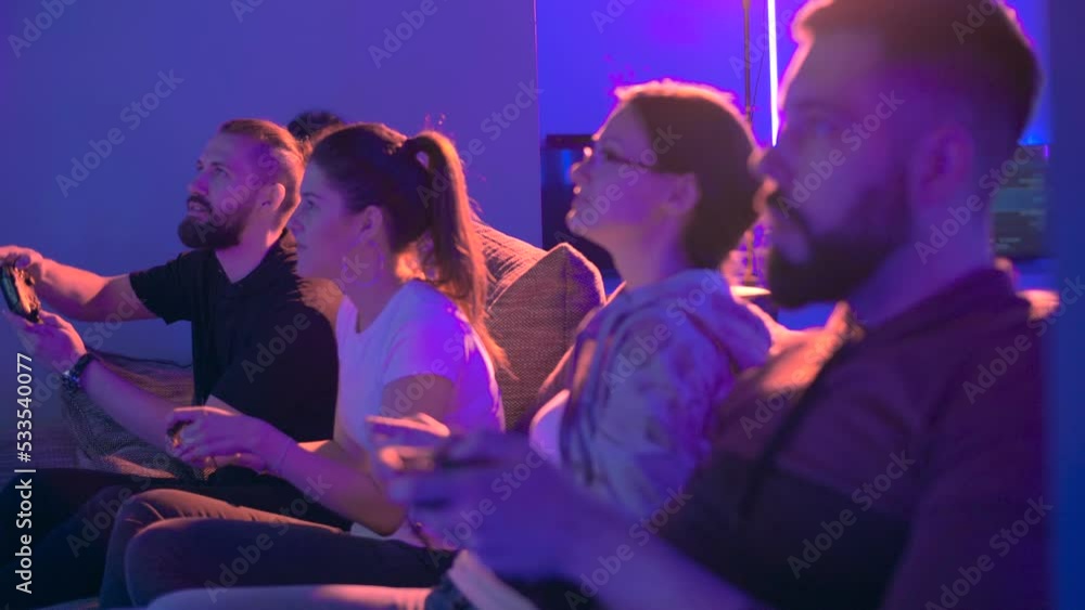 Coworkers having fun while playing games after work Coworkers having fun while playing games after work