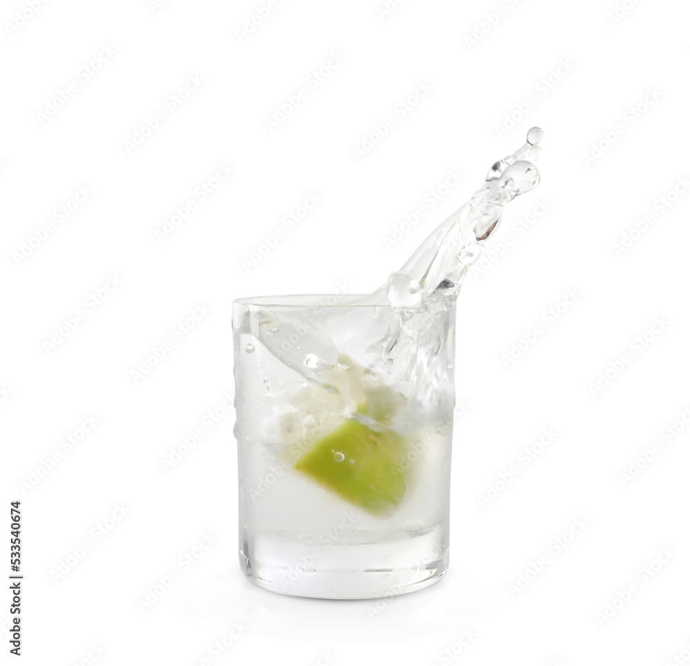 Shot of vodka with lime slice and splash isolated on white Shot of vodka with lime slice and splash isolated on white