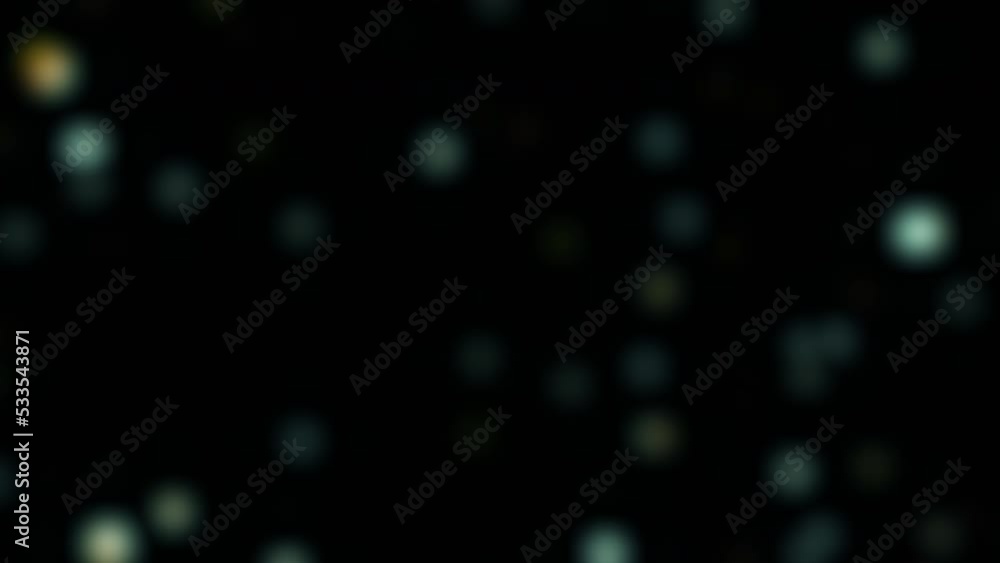 Abstract Seamless loop blurred blue bokeh bubbles. Christmas light texture background. Motion graphics. Festive background. 4K Floating blue bokeh particles on black background endless loop footage. Abstract Seamless loop blurred blue bokeh bubbles. Christmas light texture background. Motion graphics. Festive background. 4K Floating blue bokeh particles on black background endless loop footage.