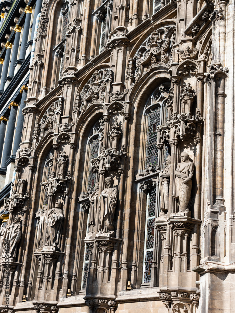 Facade of the part building of the Ghent City Hall, made in the late Gothic style with arches and openwork stone decoration, ..Belgium