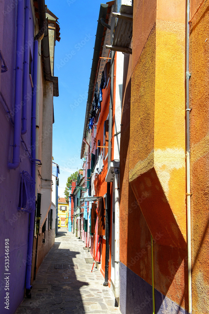 Alley in the colorful city of Burano Island, taly