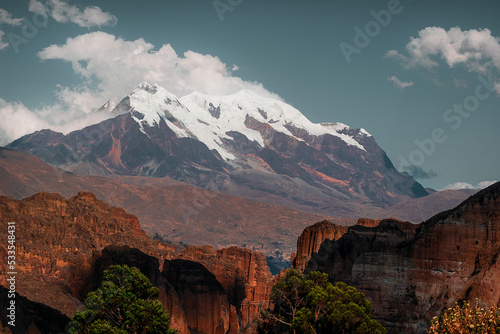 illimani seen in the middle of a beautiful canyon beautiful mountains