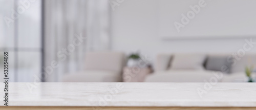 Empty mockup space on white marble tabletop in front of blurred comfortable living room