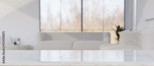 Copy space on white tabletop in front of blurred bright and comfortable living room background