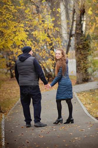 couple walking in park © Людмила Савчук