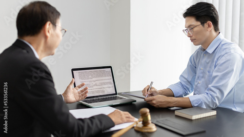 Wallpaper Mural Lawyer or judge has recommend a client sign a legal agreement in the courtroom, Legal Agreement Documents and Business Litigation Forms, scales of justice, law hammer, Litigation and legal services. Torontodigital.ca