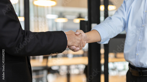 Businessman shaking hands with a lawyer or judge After signing the contract and the agreement is complete, Approval of an agreement between business and law, End of the legal case.
