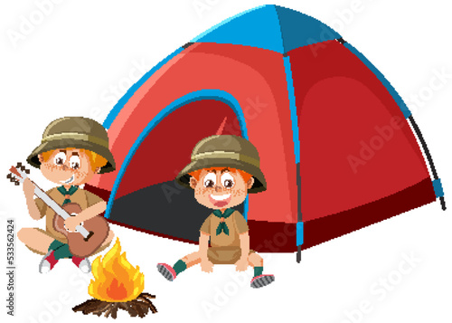 Boy scout in uniform playing guitar the camping tent