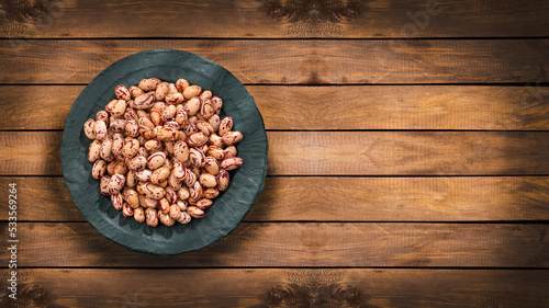 Dried pinto beans in the bowl - Phaseolus vulgaris