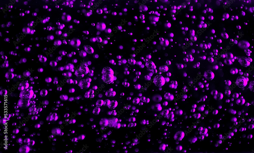 Bubbles close-up on a black background. Oxygen cocktail. Carbonated drink with lots of bright bubbles. Bubbles close-up on a black background. Oxygen cocktail. Carbonated drink with lots of bright bubbles.