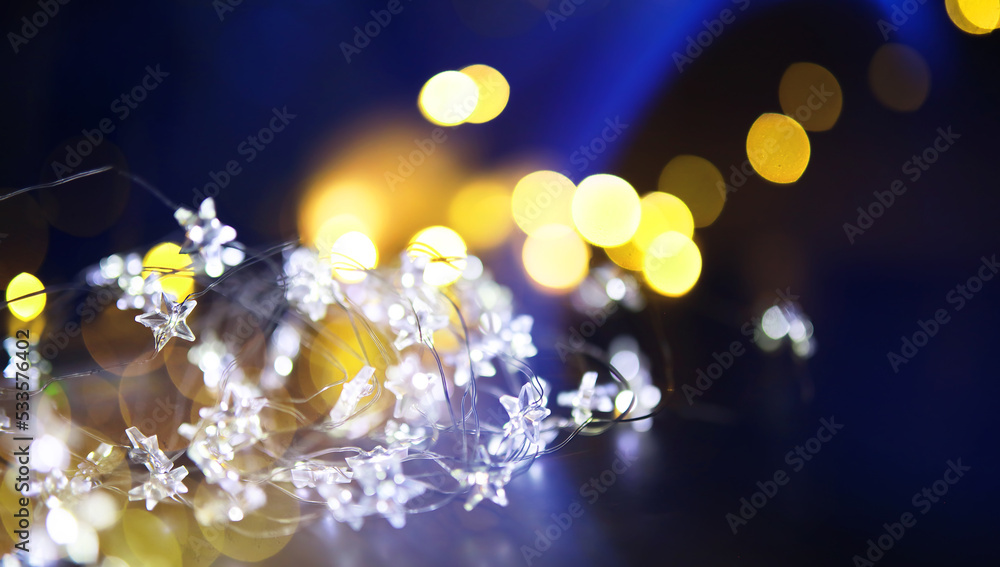 Christmas garland of glass bottles. New year and christmas concept. A garland of light bulbs with a beautiful light and bokeh