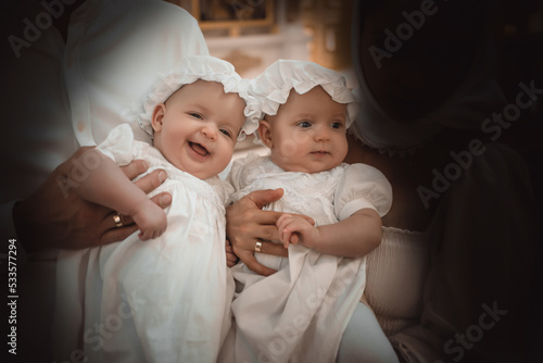 Obraz na płótnie babies in baptismal attire in a church or church came to worship in the Russian