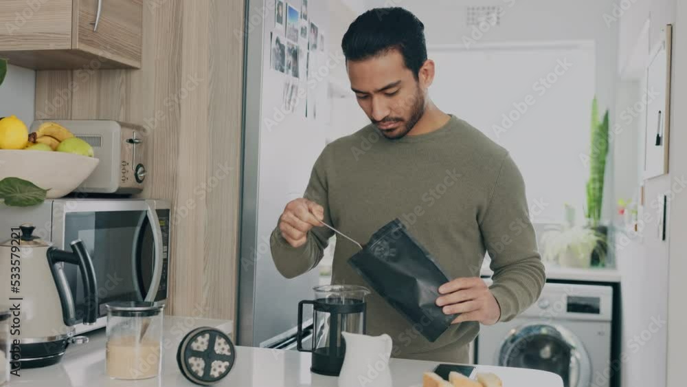 Breakfast, relax and coffee with man in kitchen, happy and content while preparing drink in his home. Wellness, coffee machine and asian male relaxing in the morning with a strong, caffeine beverage Breakfast, relax and coffee with man in kitchen, happy and content while preparing drink in his home. Wellness, coffee machine and asian male relaxing in the morning with a strong, caffeine beverage
