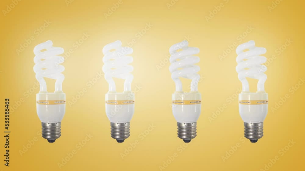 Set of blinking fluorescent light bulbs on a yellow background. Concept of idea or brainstorm. Energy saving concept. Set of blinking fluorescent light bulbs on a yellow background. Concept of idea or brainstorm. Energy saving concept.