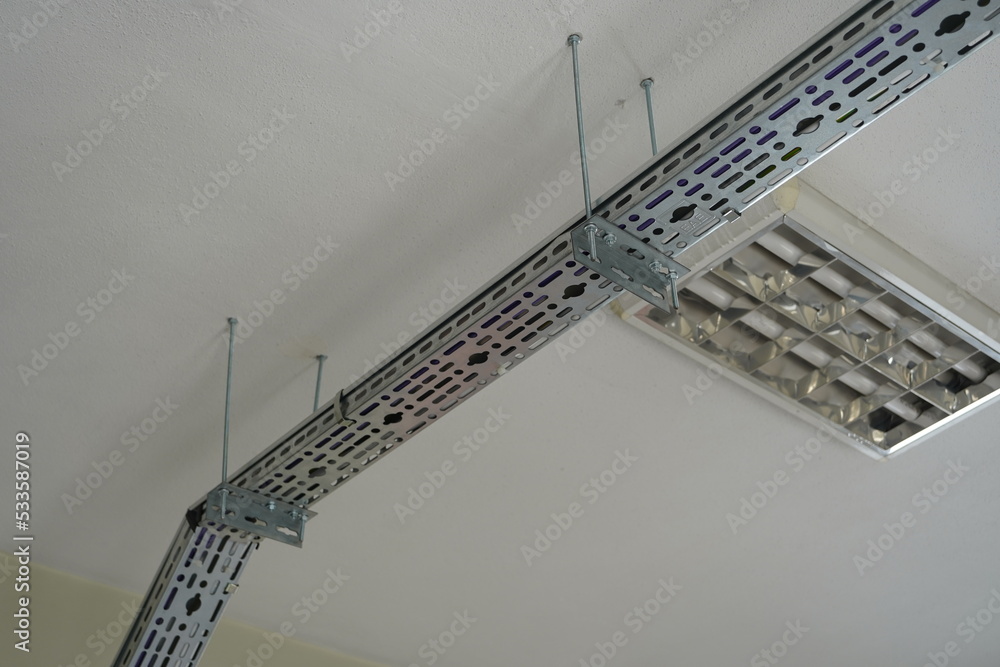 Network metal channel. Network cables inside the cable duct in an industrial building. Stock