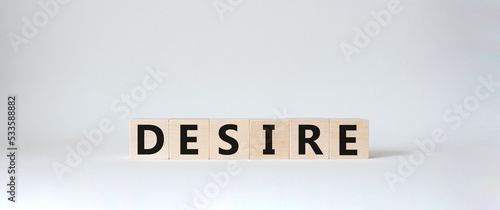 Desire symbol. Concept word Desire on wooden cubes. Beautiful white background. Business and Desire concept. Copy space.