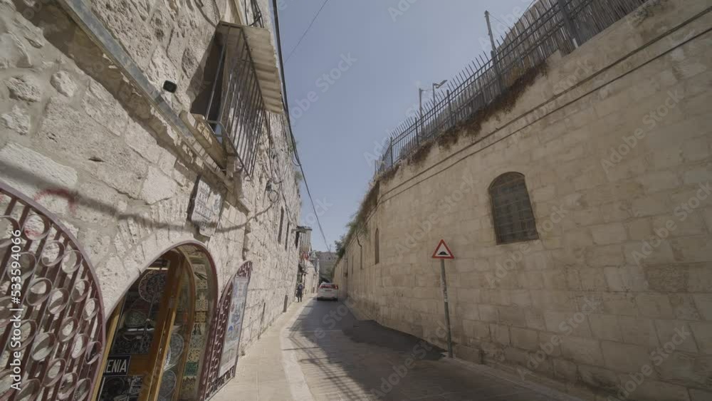 Car Driving On Narrow Street In The Neighborhood Of Beit Ya'akov In Jerusalem. Car Driving On Narrow Street In The Neighborhood Of Beit Ya'akov In Jerusalem.