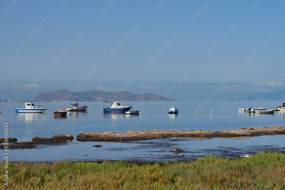 fishing boats and boats to the Egadi islands with calm sea and clear day