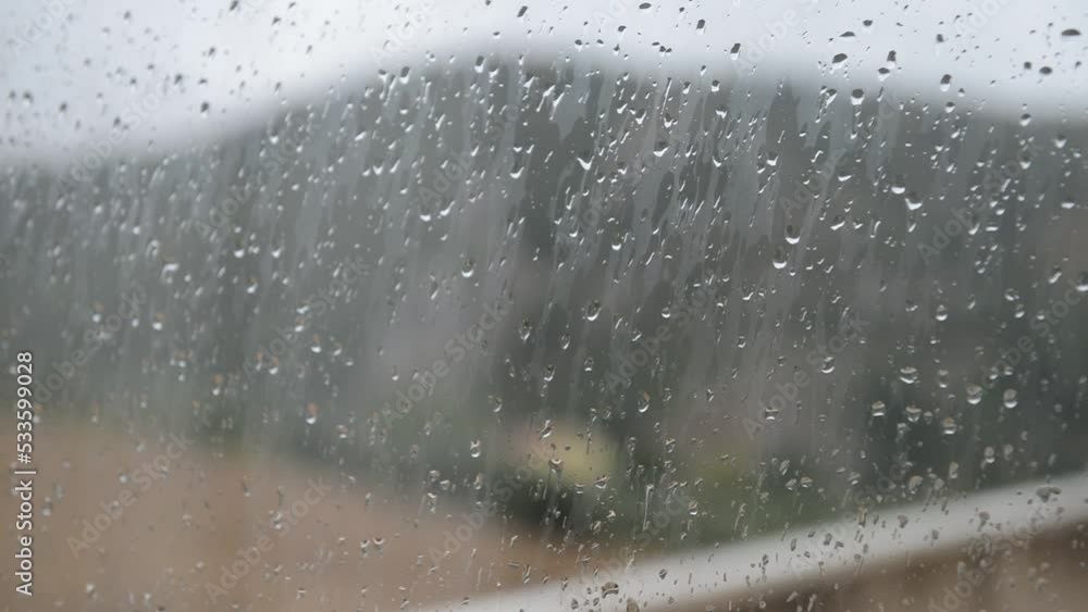 rainy day with drops on the window glass in early autumn rainy day with drops on the window glass in early autumn
