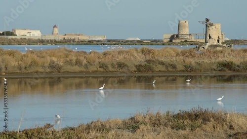 the salt pans of Trapani with the windmills in the morning