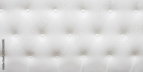 Photography Beautiful white leather upholstery sofa with buttons