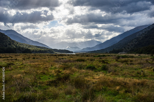 Haast River Valley, South Island, New Zealand. Misty hills in background.