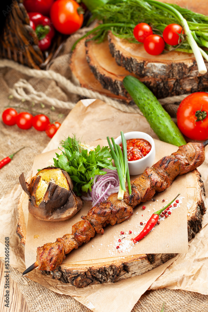 Pork skewers on a skewer. On a wooden tray. Pork skewers on a skewer. On a wooden tray.