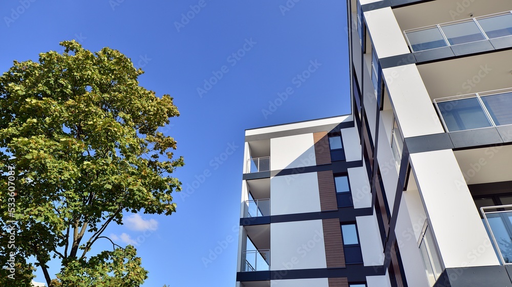 Modern residential building with new apartments in a green residential ...