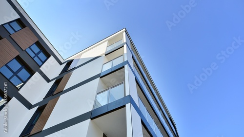 Modern luxury residential flat. Modern apartment building on a sunny day. Apartment building with a blue sky. Facade of a modern apartment building.