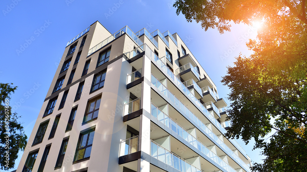 Modern residential building with new apartments in a green residential ...