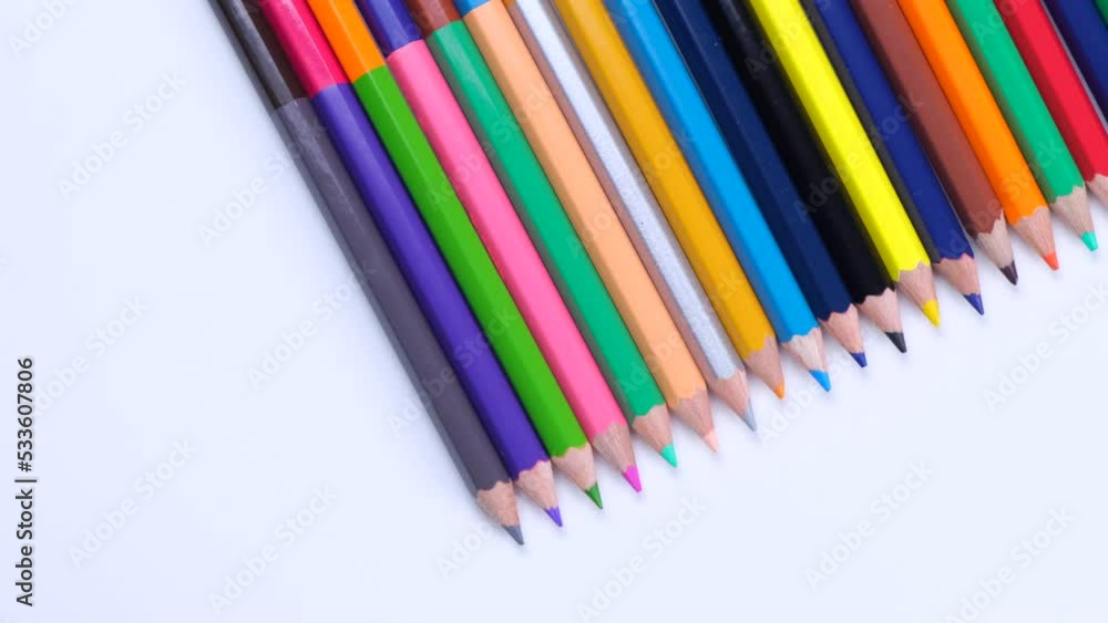 multi-colored pencils stacked in a row close-up on a white background, the concept of creativity, creativity, study or school education multi-colored pencils stacked in a row close-up on a white background, the concept of creativity, creativity, study or school education