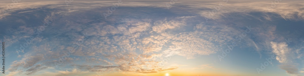 Dark blue sunset sky panorama with golden Cirrus clouds. Seamles