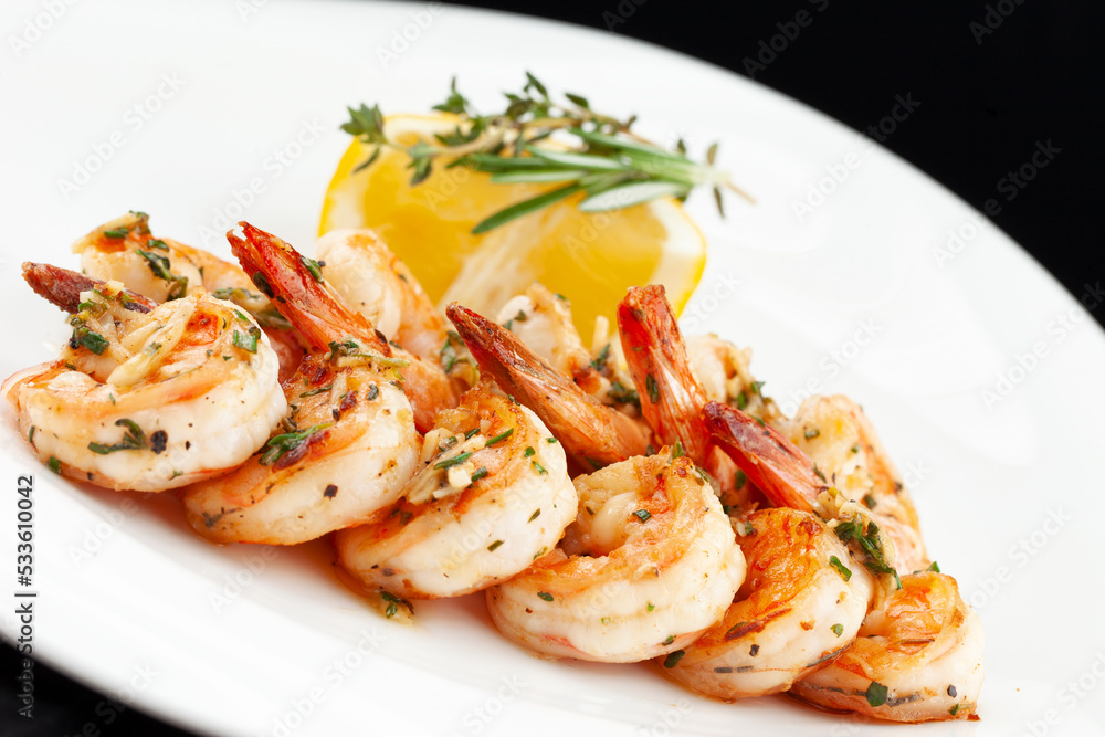 Fried shrimp and lemon in a plate. Fried shrimp and lemon in a plate.